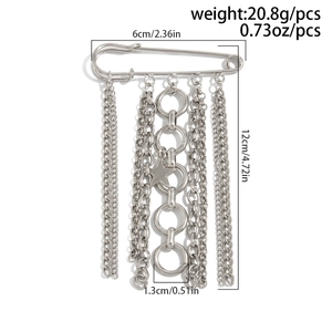 Detail of silver alloy DIY brooch with layered chains, rings, and star charm pendant