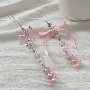 Detail view of pink bow beaded charms with heart beads and resin bear for bag decoration