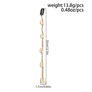 Détail d'extension de cheveux en coquillage montrant 32 cm de long et 13,8 g de poids