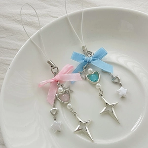 Close-up of pink and blue beaded keychains with ribbon bows and starfish charms