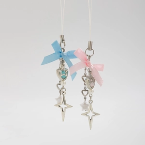 Detailed shot of ocean-style shell and starfish charms with cute ribbon bows and beads