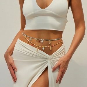 Close-up of double-layer beaded waist chain with starfish and seashell charms