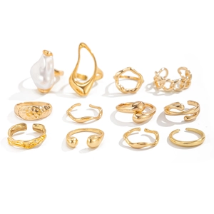 Detailed set of 12 gold-tone rings featuring baroque imitation pearls and geometric designs