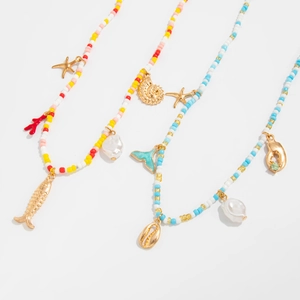 Detail of colorful beaded ocean chains with starfish, mermaid tail and shell charms