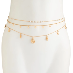 Detailed close-up of layered gold waist chain featuring starfish and shell pendants