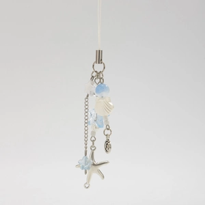 Ocean style keychain with silver starfish, seashell charms and blue beaded bow design