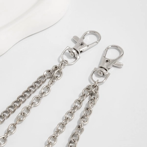 Detailed view of silver punk chain with lobster clasps and polished metal links