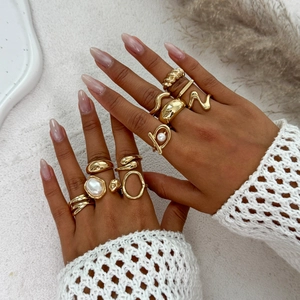 Gold bohemian stackable ring set featuring baroque imitation pearls and organic shapes