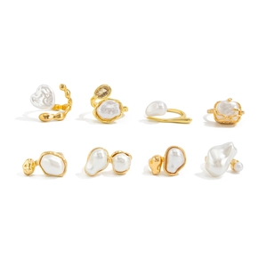Detail view of gold baroque pearl ring set with crystal accents in a vintage french style