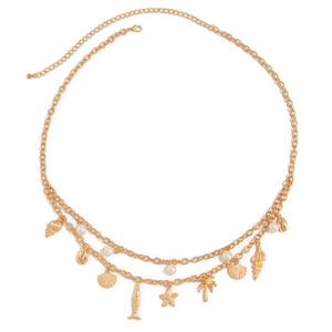 Bohemian gold waist chain featuring starfish and shell charms with pearl accents