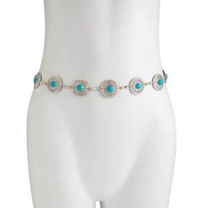 Detail of silver waist chain with round turquoise stones and spiral engraved metal disks