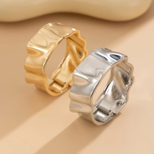 Minimalist wide metal wavy bangles in gold and silver finish with hinged closure