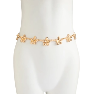 Close-up of golden flower-shaped links on a stylish metal waist chain for women