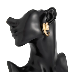 Macro shot of liquid metal gold flower earring on mannequin showing wavy fluid textures