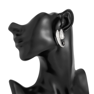 Close-up of silver liquid lava earrings with metallic texture on a model's profile
