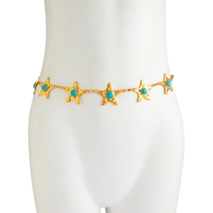 Détail d'une chaîne de taille étoile de mer dorée avec perles turquoises sur mannequin