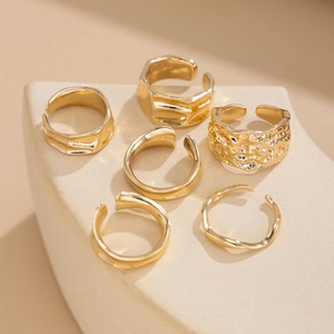 Set of six gold-tone adjustable rings featuring hammered textures and minimalist designs