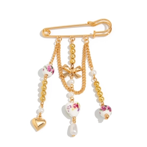 Elegant gold safety pin brooch with ceramic floral beads, heart charms and white pearls