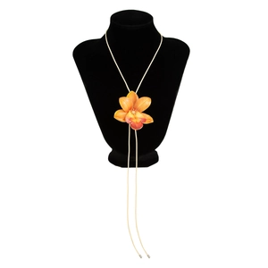 Close-up of a 3D orange-red orchid flower pendant on a long beige wax cord choker