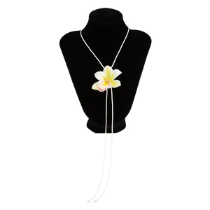 Minimalist white orchid flower necklace with wax rope cord on a black bust display