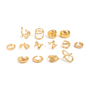 Flat lay of 14-piece gold plated ring set featuring irregular lava textures and geometric styles