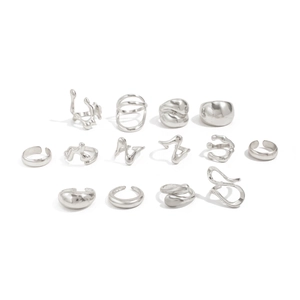 Detailed macro view of 14-piece silver geometric liquid metal rings set in minimalist style