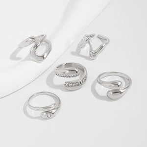 Detail view of 5-piece silver liquid metal rings set with cubic zirconia accents