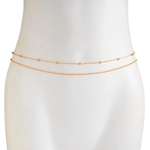 Detail of double-layer gold snake waist chain featuring delicate metal beads and rope chain