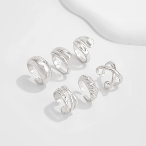 Detailed close-up of a 6-piece silver geometric minimalist ring set with polished finishes