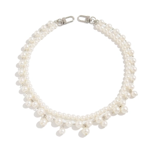 Close-up of double-layer faux pearl waist chain with silver lobster clasp and pearl fringe