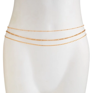 Close-up of three-layer gold waist chain set including Figaro and sequin styles