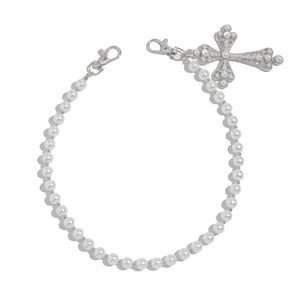 Detail of pearl beads jeans chain with vintage silver cross pendant and lobster clasps