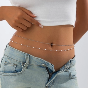 Double-layered silver body chain with white pearls on a minimalist metal snake bone link