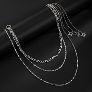Detail of silver multi-layer waist chain with punk style metal links and star pendants
