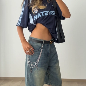 Punk multilayer silver metal waist chain with cross pendants on denim shorts