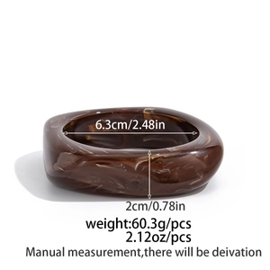 Detail showing chunky brown marble resin bracelet dimensions and polished texture