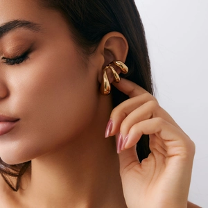 Gold curved multi-layer claw ear cuff earrings with a polished mirror finish for women