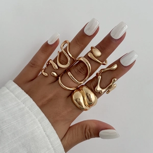 Minimalist gold adjustable rings set featuring irregular geometric and lava designs
