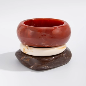Three-piece set of acrylic resin bracelets in red, cream, and marble brown textures