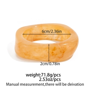 Detailed view of wide amber resin bangle with marble texture and dimensions measurements