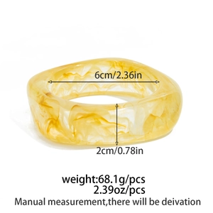 Irregular yellow resin cuff bangle with marble texture and product dimensions detail