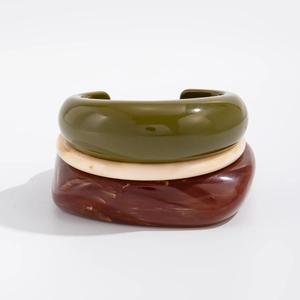 Set of three chunky resin bangles in green, marble white, and tortoiseshell patterns