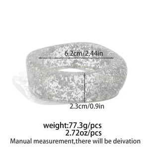 Detail view of irregular resin bangle with silver foil glitter and dimension markings