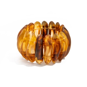 Detailed view of translucent amber resin bracelet with vintage tortoiseshell texture