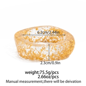 Translucent resin bangle with gold foil flakes showing 6.2cm inner diameter dimensions