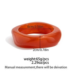 Detail showing dimensions of translucent orange resin bangle with gold foil flakes