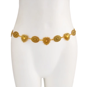 Detailed view of bohemian gold waist chain with sunburst medals and hollow heart charms