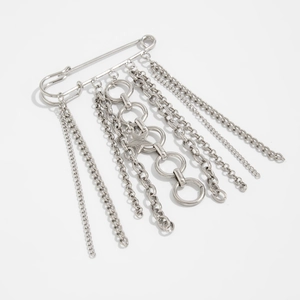 Detail of silver multi-layer tassel chain with star charm for jeans and clothing