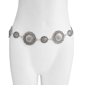Detail of silver vintage metal body chain with embossed mandala pattern on concho discs