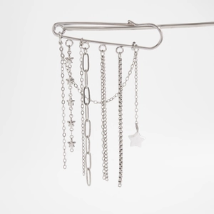 Close-up of silver star tassel pin with five distinct hanging metal chains and star charms